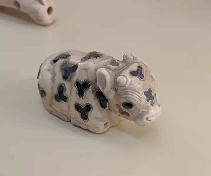 Lying cattle with indentations in the limestone, Uruk, located at the Pergamon museum